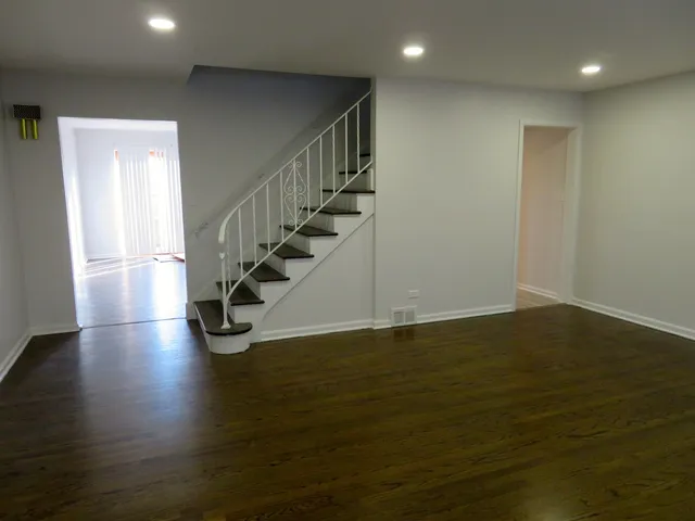 a view of entryway with wooden floor