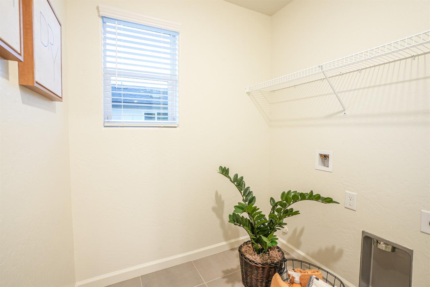 2329 North Raleigh Drive Fresno, CA 93727 - Photo 15 of 25 a view of a window with a plant