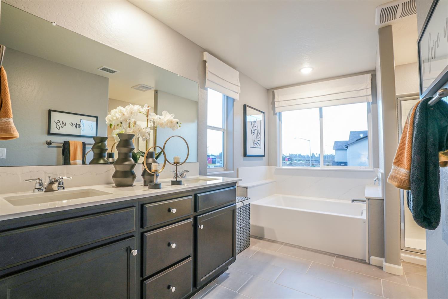 2329 North Raleigh Drive Fresno, CA 93727 - Photo 18 of 25 a bathroom with a tub sink and mirror