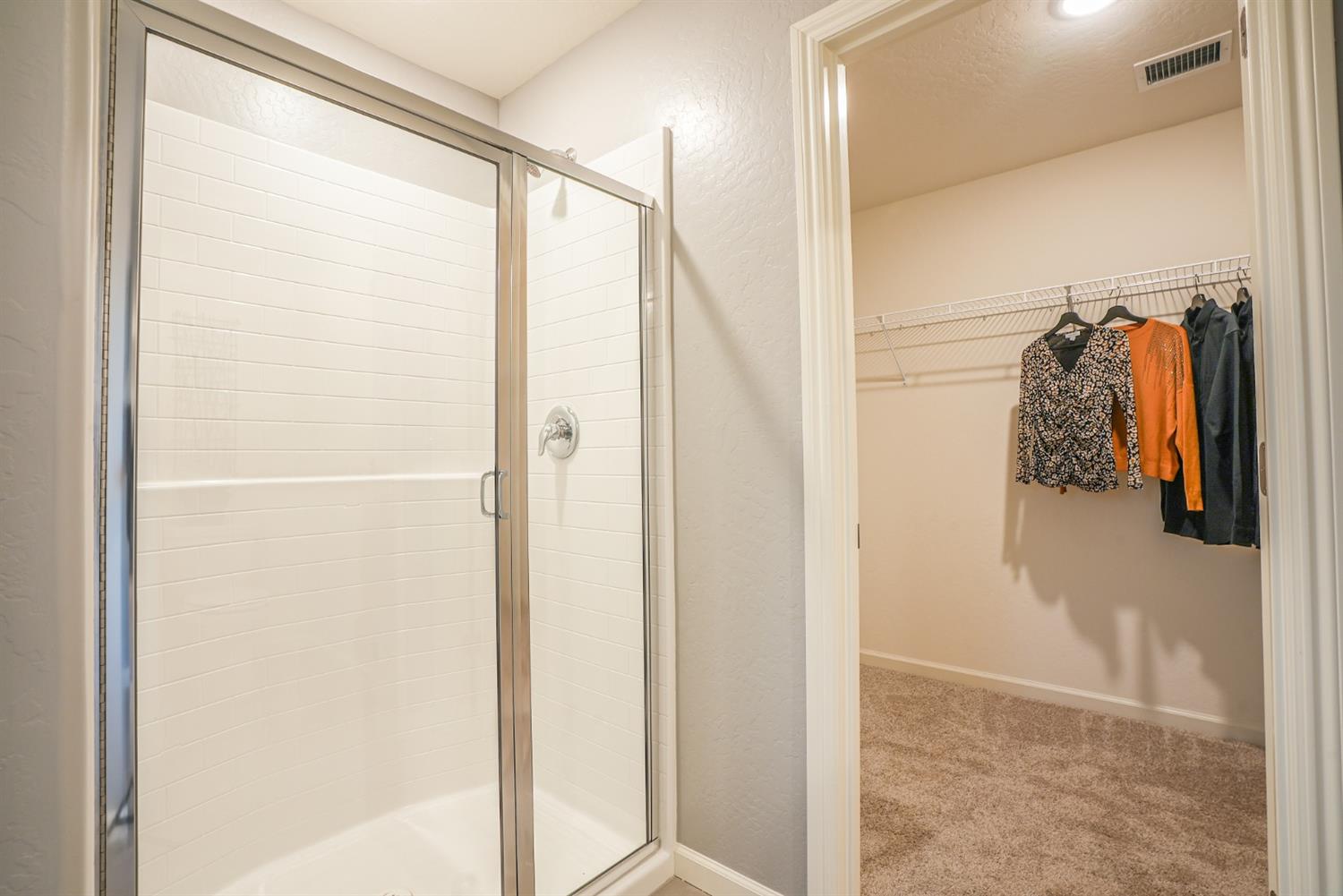 2329 North Raleigh Drive Fresno, CA 93727 - Photo 19 of 25 a view of walk in closet with clothes and shoes