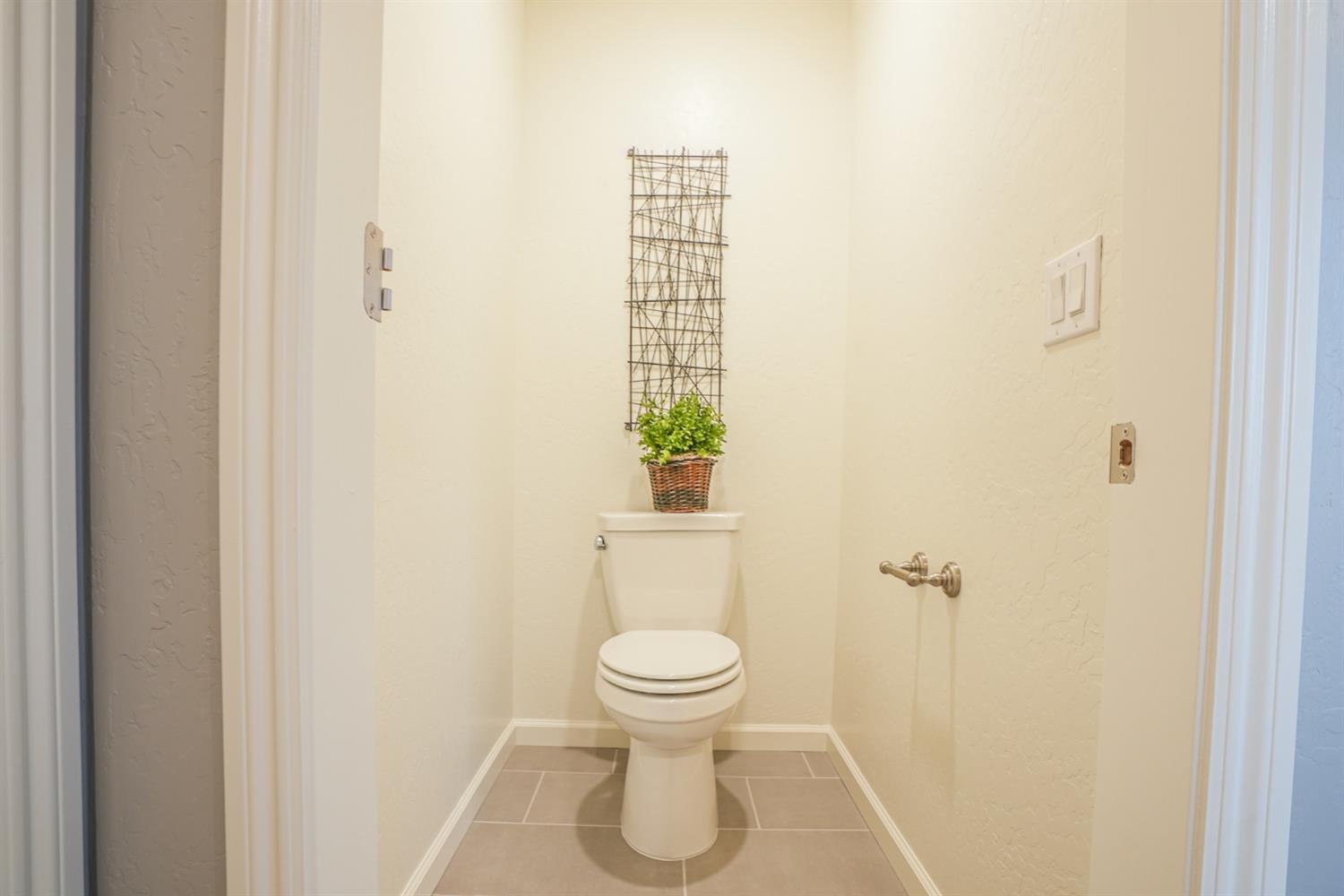 2329 North Raleigh Drive Fresno, CA 93727 - Photo 20 of 25 a bathroom with a toilet and a shower