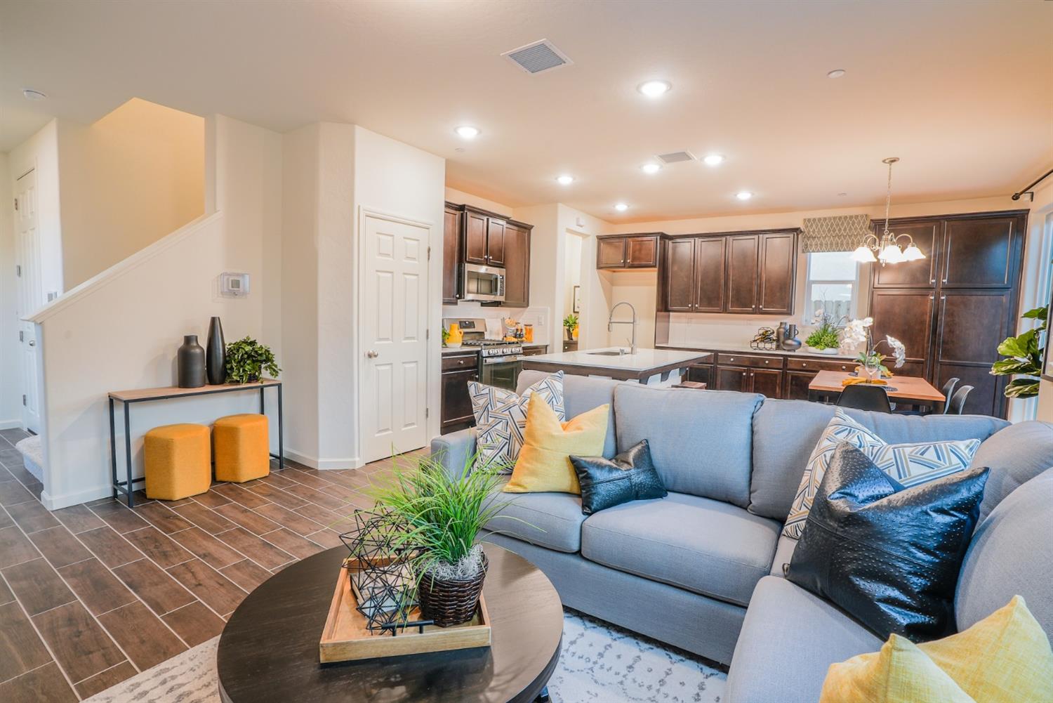 2329 North Raleigh Drive Fresno, CA 93727 - Photo 2 of 25 a living room with furniture kitchen view and a potted plant