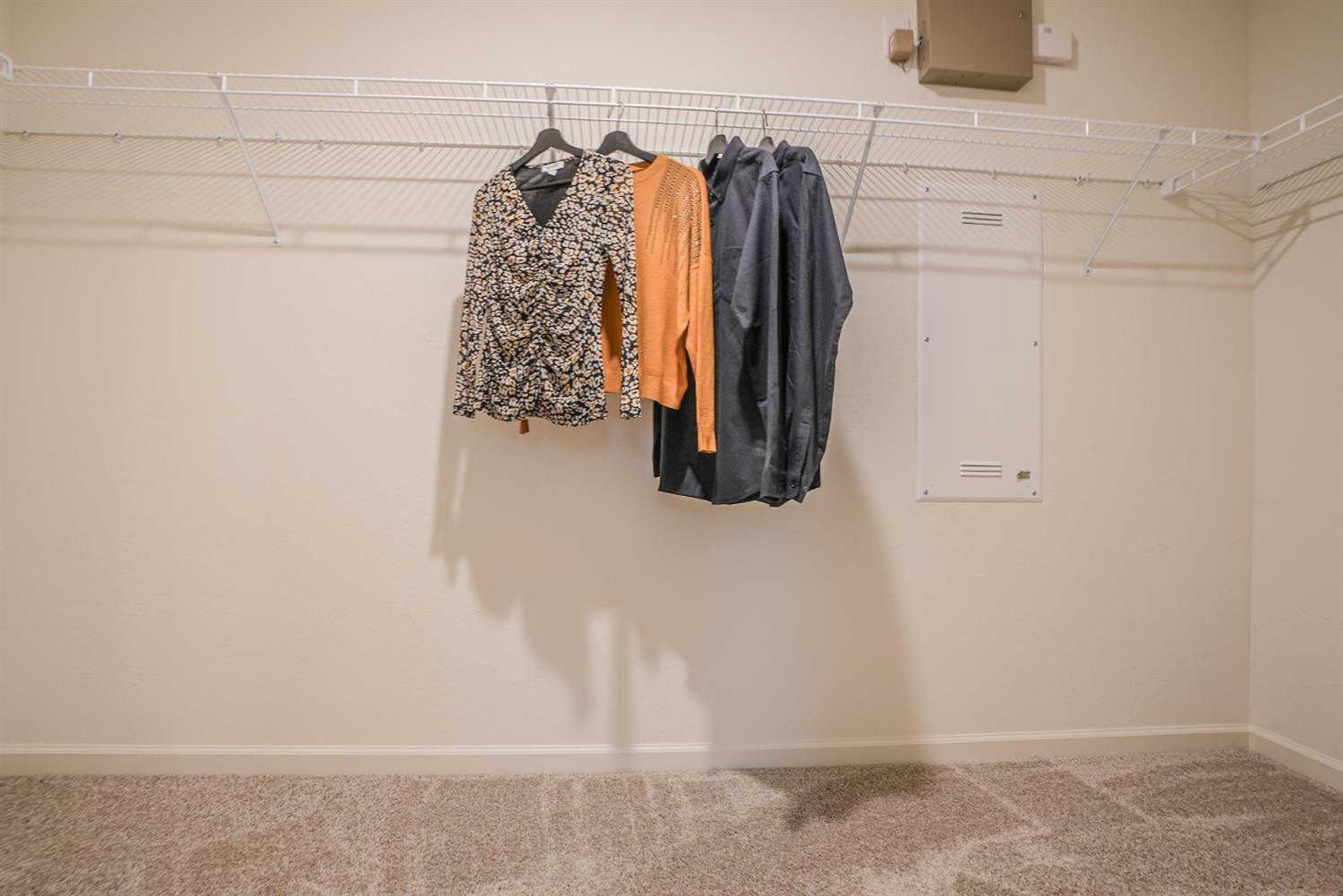 2329 North Raleigh Drive Fresno, CA 93727 - Photo 21 of 25 a view of walk in closet with clothes