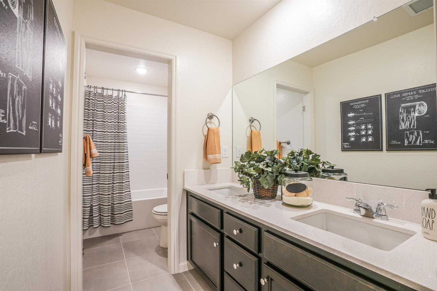 2329 North Raleigh Drive Fresno, CA 93727 - Photo 25 of 25 a bathroom with a sink and a mirror