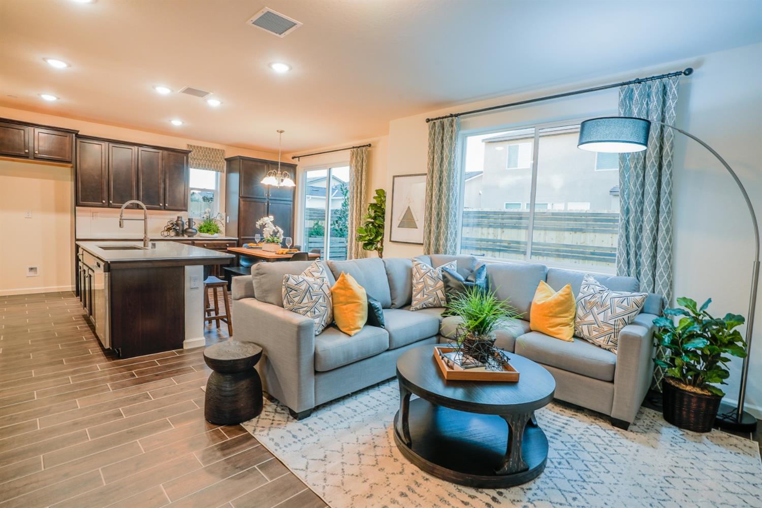 2329 North Raleigh Drive Fresno, CA 93727 - Photo 6 of 25 a living room with furniture potted plant and large windows