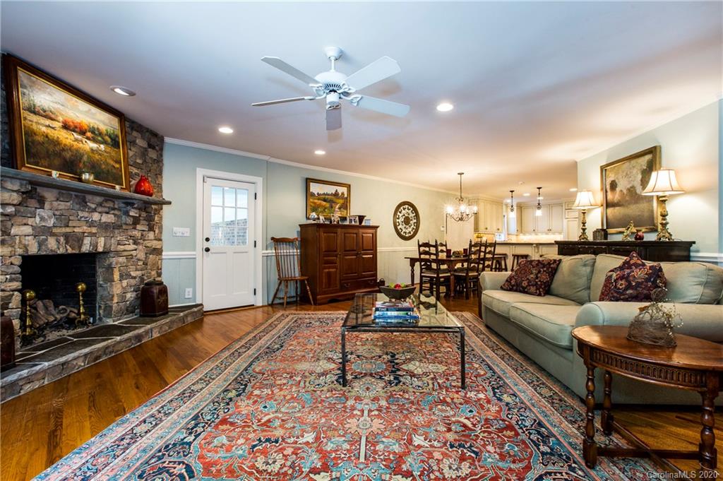 2930 Wheelock Road Charlotte, NC 28211 - Photo 15 of 48 a living room with furniture and a fireplace