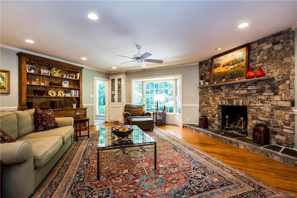 2930 Wheelock Road Charlotte, NC 28211 - Photo 16 of 48 a living room with fireplace furniture and a flat screen tv