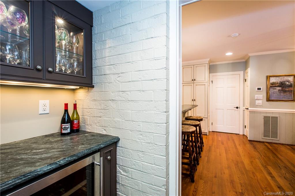 2930 Wheelock Road Charlotte, NC 28211 - Photo 21 of 48 a kitchen with stainless steel appliances wooden floor and a refrigerator