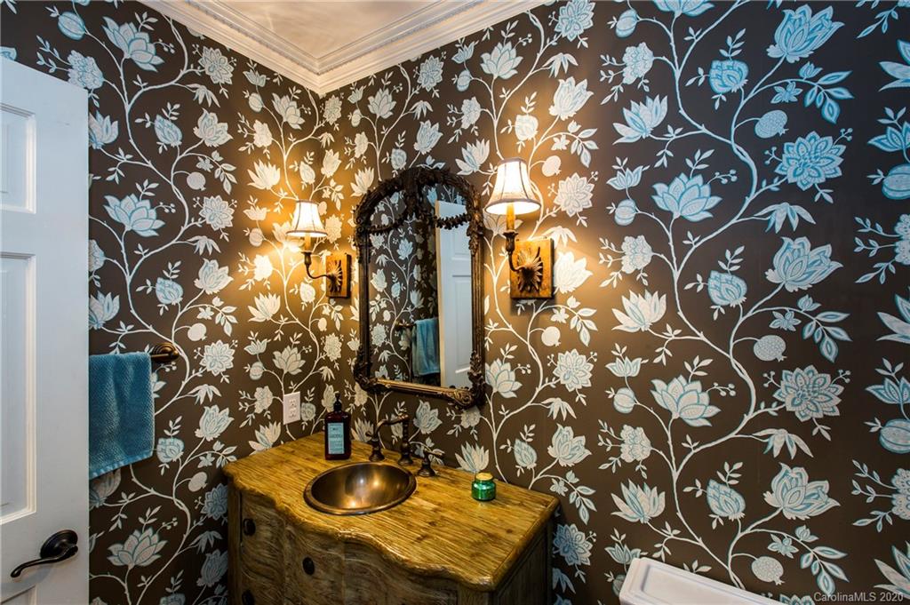 2930 Wheelock Road Charlotte, NC 28211 - Photo 28 of 48 a bathroom with a sink and mirror