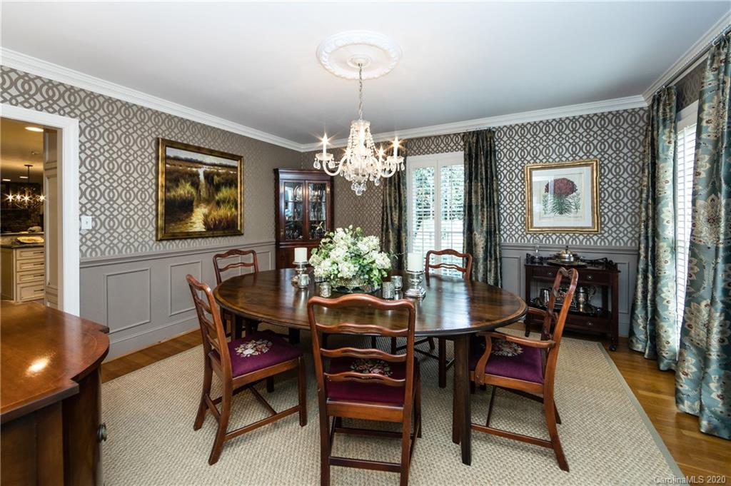 2930 Wheelock Road Charlotte, NC 28211 - Photo 30 of 48 a view of a dining room with furniture and chandelier