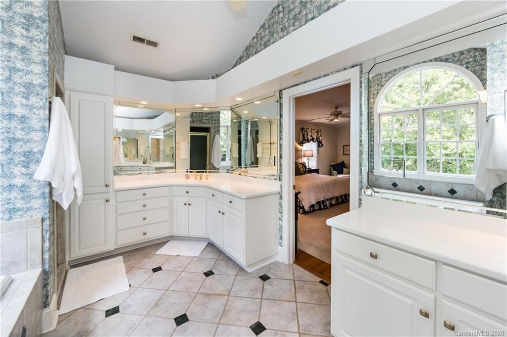 2930 Wheelock Road Charlotte, NC 28211 - Photo 33 of 48 a large white bathroom with a sink mirror and window