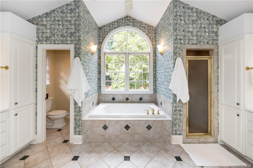 2930 Wheelock Road Charlotte, NC 28211 - Photo 34 of 48 a bathroom with a sink and a mirror