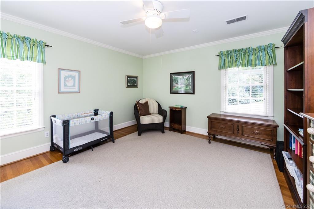 2930 Wheelock Road Charlotte, NC 28211 - Photo 39 of 48 a bedroom with furniture and a window