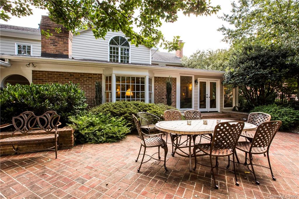 2930 Wheelock Road Charlotte, NC 28211 - Photo 45 of 48 a view of a patio with table and chairs and potted plants