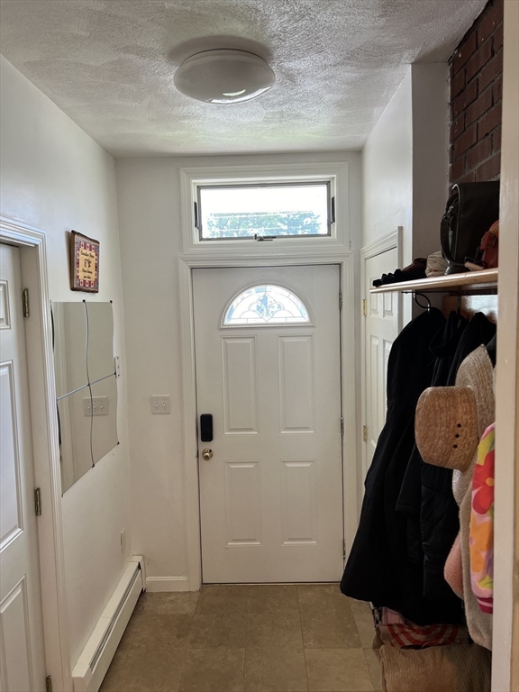 11 Garrison Road, Unit 1 Arlington, MA 02474 - Photo 32 of 42 a view of entryway with wooden floor