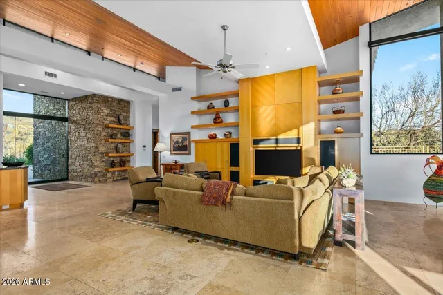 a kitchen with granite countertop a sink a stove cabinets and counter space