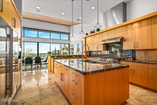 a dining room with furniture and a window