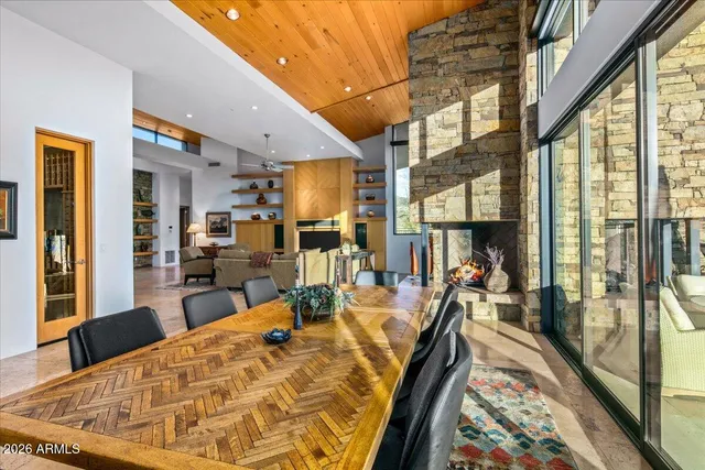 a living room with furniture and a floor to ceiling window