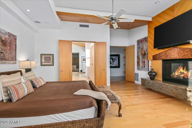 a bedroom with two beds and a large window