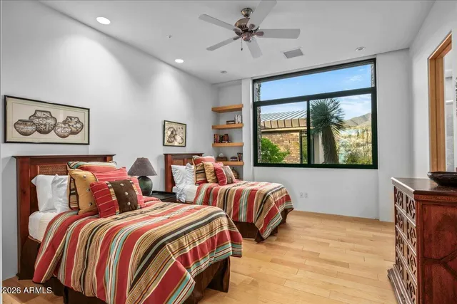 a living room with furniture tv and a large window