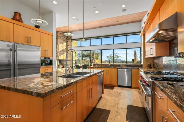 a view of a chairs and table in a patio