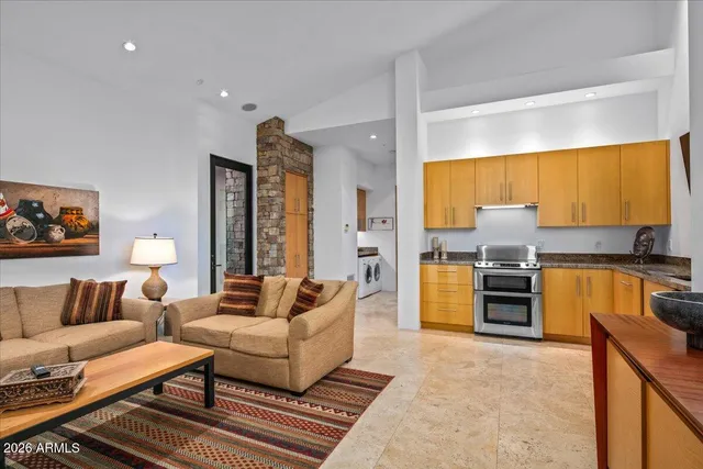 a view of a swimming pool with a table and chairs
