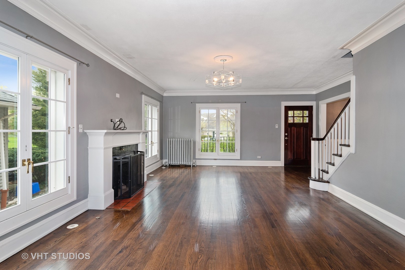 376 Bartram Road Riverside, IL 60546 - Photo 2 of 15 wooden floor fireplace and windows in an empty room