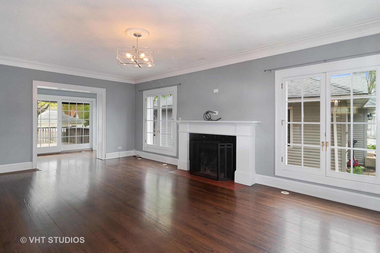 376 Bartram Road Riverside, IL 60546 - Photo 3 of 15 a view of an empty room with wooden floor and a window