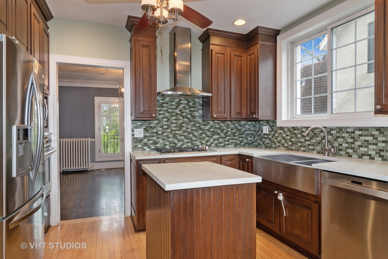 376 Bartram Road Riverside, IL 60546 - Photo 5 of 15 a kitchen with stainless steel appliances granite countertop a sink and a refrigerator