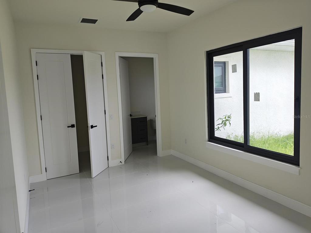 267 Santa Marta Street Port Charlotte, FL 33954 - Photo 5 of 13 a view of an empty room with a window