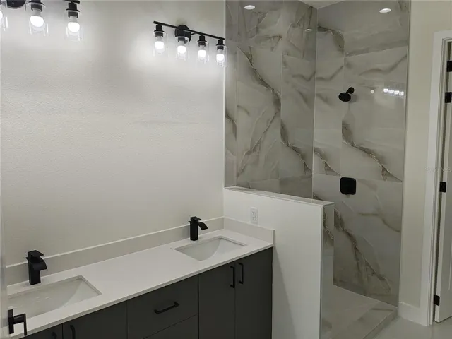 a bathroom with a sink and mirror