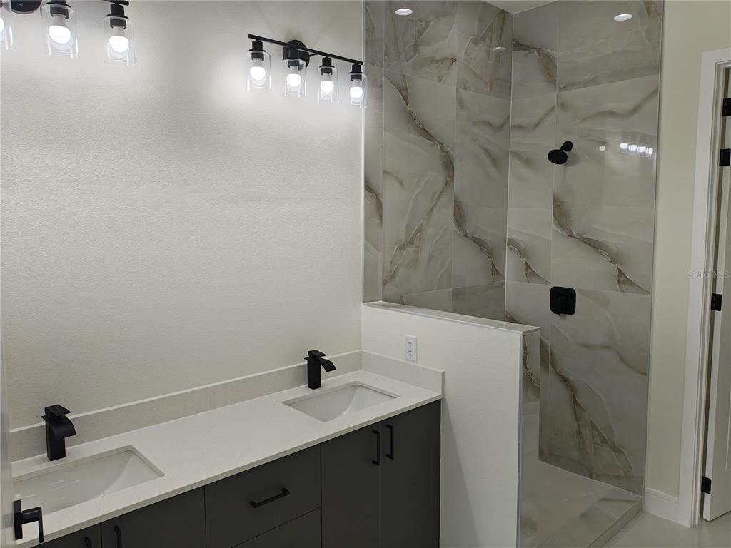 267 Santa Marta Street Port Charlotte, FL 33954 - Photo 10 of 13 a bathroom with a sink and mirror