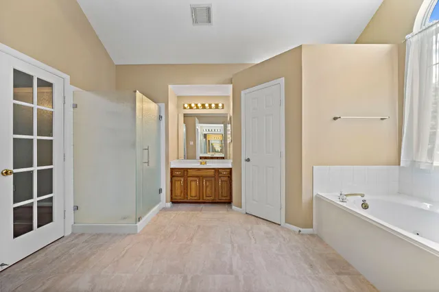 a view of bathroom with tub shower and sink