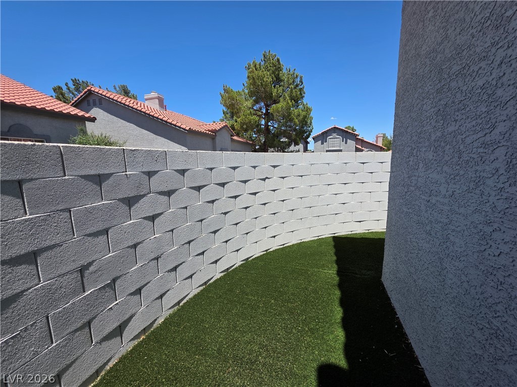 2275 Ramsgate Drive Henderson, NV 89074 - Photo 8 of 84 A private outdoor retreat with maintenance-free turf, fully fenced for ultimate privacy.