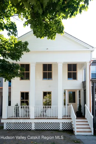 a front view of a house with a porch
