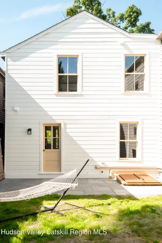 a view of a house with a backyard