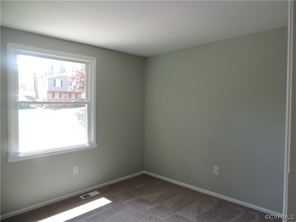 9316 Becar Road North Chesterfield, VA 23236 - Photo 13 of 32 an empty room with a window