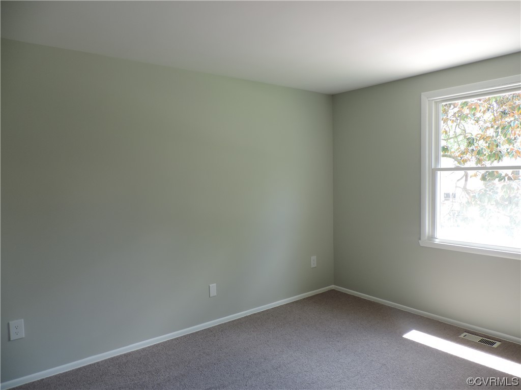 9316 Becar Road North Chesterfield, VA 23236 - Photo 14 of 32 an empty room with a window
