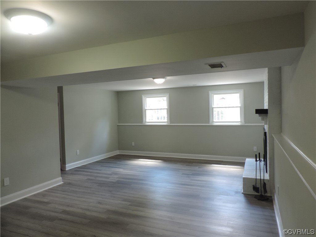 9316 Becar Road North Chesterfield, VA 23236 - Photo 22 of 32 an empty room with wooden floor and windows