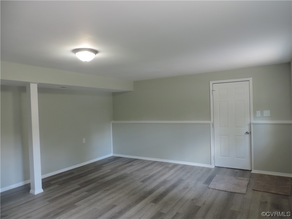 9316 Becar Road North Chesterfield, VA 23236 - Photo 23 of 32 an empty room with wooden floor and empty shelves