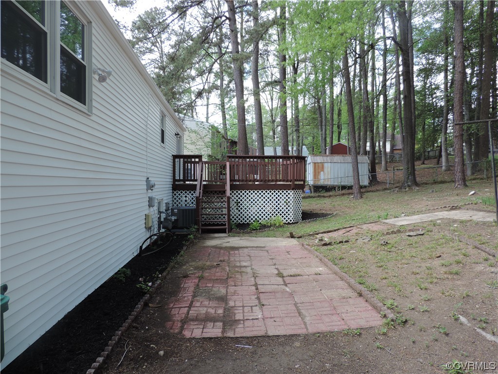 9316 Becar Road North Chesterfield, VA 23236 - Photo 31 of 32 a backyard of a house with barbeque oven and trees