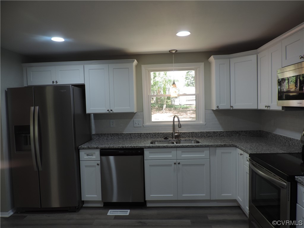 9316 Becar Road North Chesterfield, VA 23236 - Photo 4 of 32 a kitchen with a sink stove and refrigerator