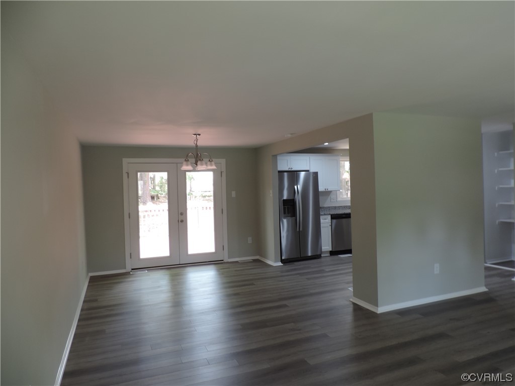 9316 Becar Road North Chesterfield, VA 23236 - Photo 6 of 32 a hallway with wooden floor and windows