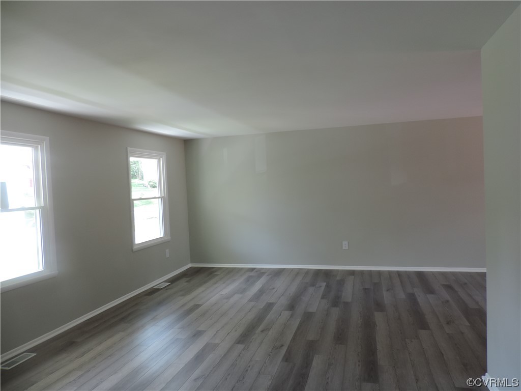 9316 Becar Road North Chesterfield, VA 23236 - Photo 7 of 32 an empty room with wooden floor and windows
