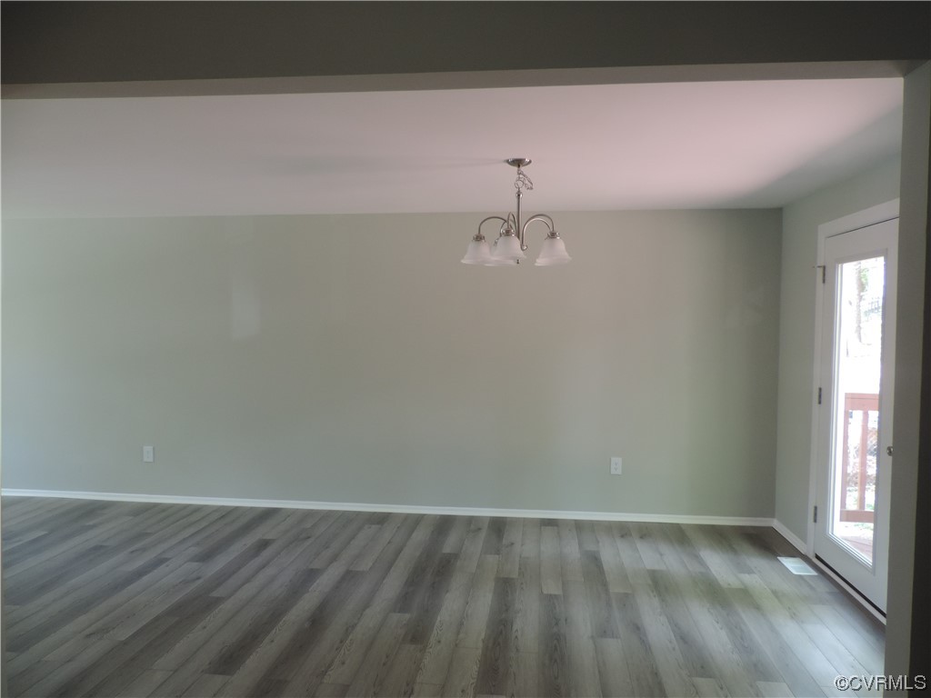 9316 Becar Road North Chesterfield, VA 23236 - Photo 8 of 32 a view of a room with wooden floor and fan