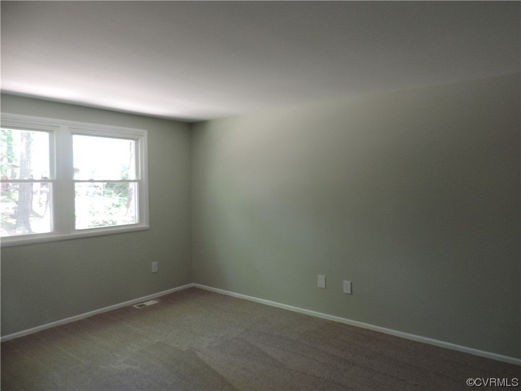 9316 Becar Road North Chesterfield, VA 23236 - Photo 9 of 32 an empty room with a window