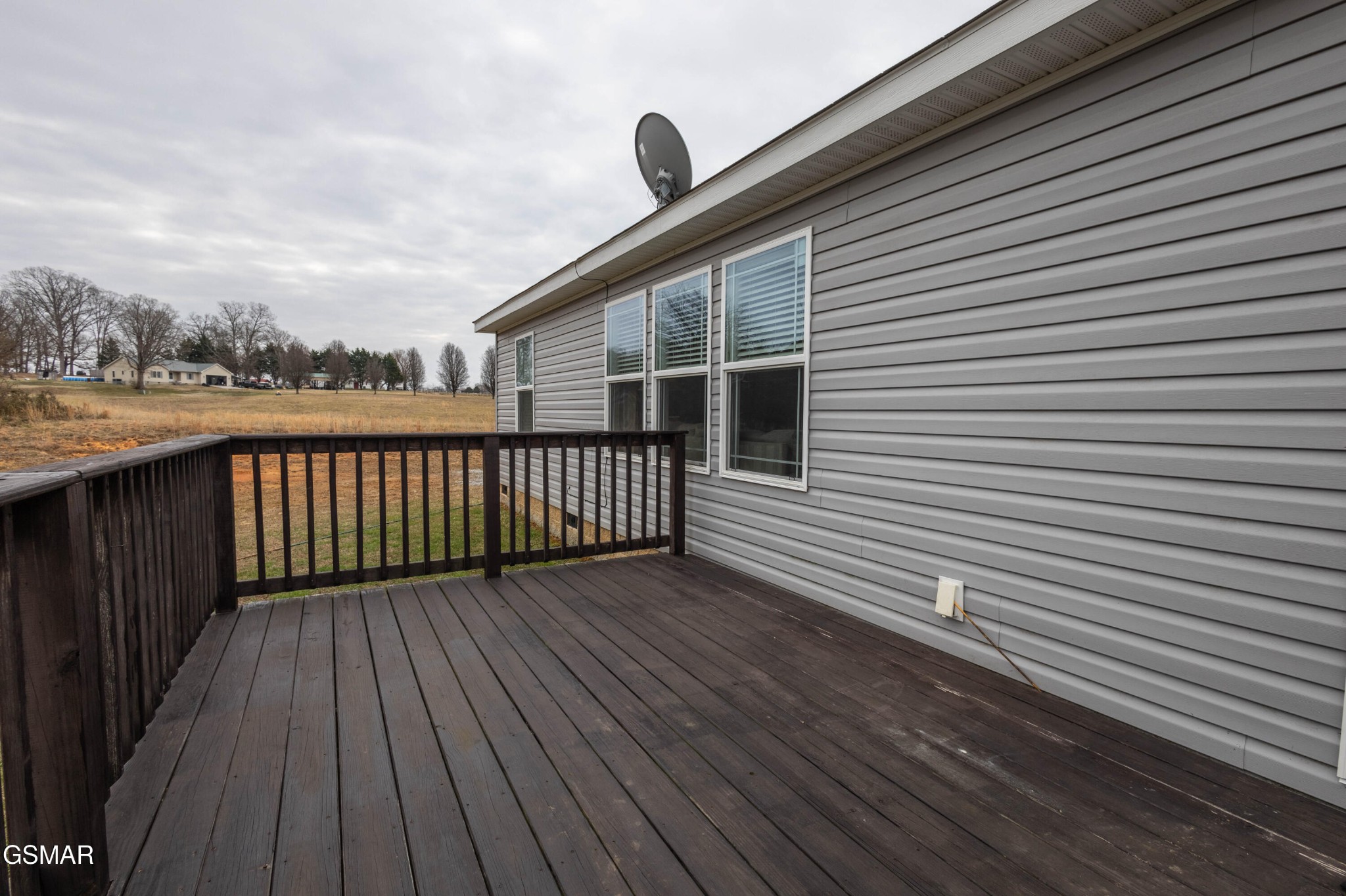1165 Ballplay Road Madisonville, TN 37354 - Photo 21 of 34 a view of a wooden deck with a yard