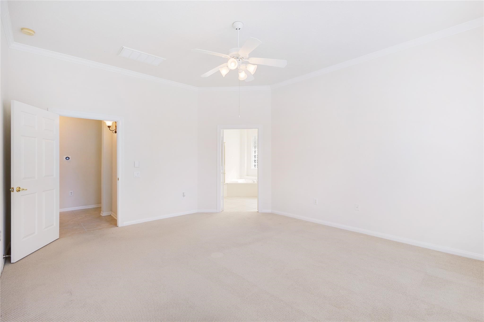 43 Tarrytown Way Conroe, TX 77384 - Photo 22 of 40 a view of an empty room with a chandelier fan