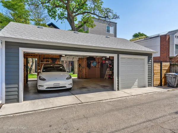 a view of a car parked front of a building