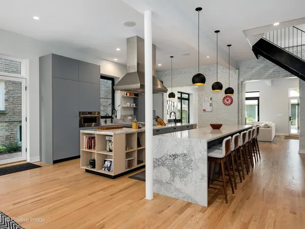 a view of kitchen with stainless steel appliances kitchen island